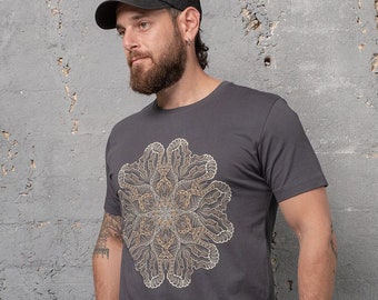 May include: A dark gray t-shirt with a gold mandala design. The shirt has short sleeves and a crew neck.