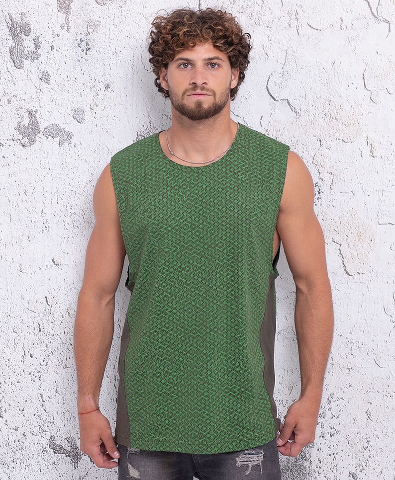 May include: A sleeveless green tank top with a geometric pattern. The tank top has a dark green side panel.