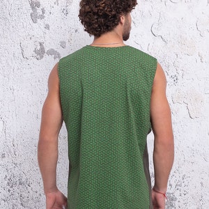 May include: A sleeveless shirt with a green and brown geometric pattern. The shirt is made of a soft, comfortable fabric and has a relaxed fit.