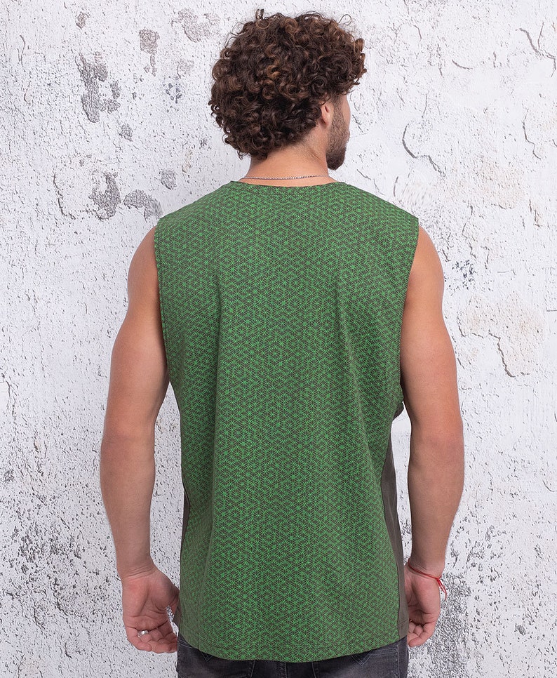May include: A sleeveless shirt with a green and brown geometric pattern. The shirt is made of a soft, comfortable fabric and has a relaxed fit.