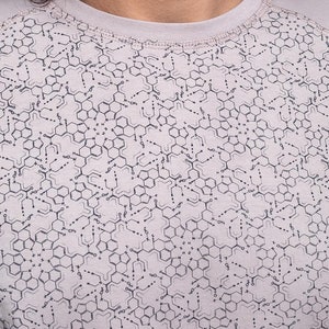 May include: A light gray t-shirt with a repeating pattern of black chemical structures.