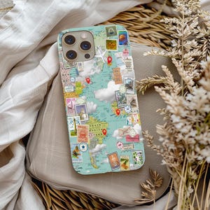 May include: A phone case featuring a world map design with travel-themed stamps and red pin markers. The case has a light blue background with white cloud illustrations. The stamps depict various landmarks and destinations.