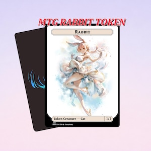 Könnte beinhalten: Eine Magic: The Gathering Rabbit Token-Karte mit einer Aquarellillustration einer weiblichen Figur mit Hasenohren und einem fließenden weißen Kleid. Die Karte ist mit "Rabbit" und "Token Creature - Cat 1/1" beschriftet. Der Hintergrund ist hellviolett.