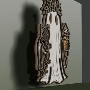 May include: A layered wooden wall hanging featuring a central white ghost figure wearing a floral crown, flanked by a black cat on the left and a swirled ice cream cone on the right. The design uses dark brown and white tones with depth.