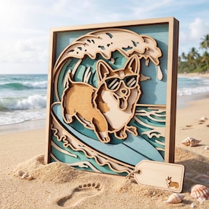 May include: Wooden layered art piece featuring a corgi dog wearing sunglasses surfing a wave. The artwork is set in a wooden frame and includes a small wooden tag with a corgi illustration. The background shows a beach scene.