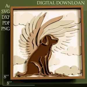 Puede incluir: Una obra de arte en papel en capas que presenta un perro marrón con alas de ángel, sobre un fondo de nubes. La obra de arte está enmarcada en una caja de sombra marrón, con las dimensiones de 20.32 cm x 20.32 cm visibles. El texto "DIGITAL DOWNLOAD" está en la parte superior.