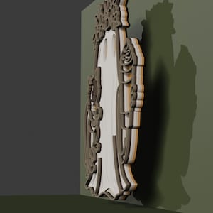 May include: A layered, three-dimensional wall art piece featuring a central ghost figure adorned with a floral crown. The design is constructed from stacked, light-colored material with dark brown edges, creating depth and a distinct silhouette against the wall.