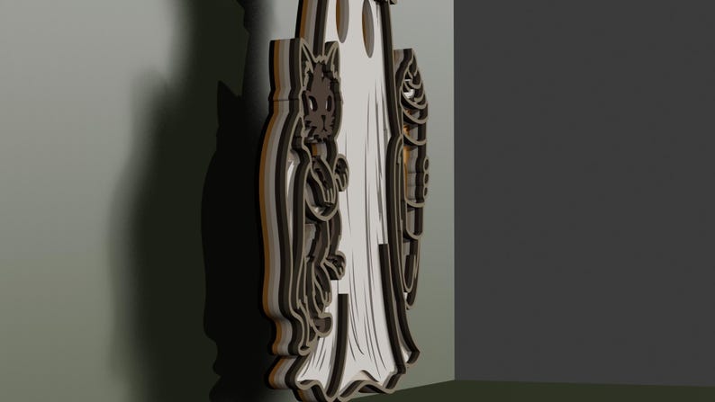 May include: A layered wooden wall decoration featuring a central white ghost figure flanked by a dark brown cat on the left and a brown corn cob on the right. The piece has a multi-dimensional, stacked construction with visible dark edges and depth.