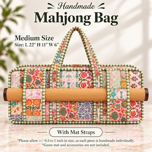 May include: A rectangular handmade Mahjong bag featuring a colorful floral patchwork pattern with green and white striped trim. The bag includes integrated straps holding a rolled mat and measures L 22 inches, H 11 inches, W 6 inches.