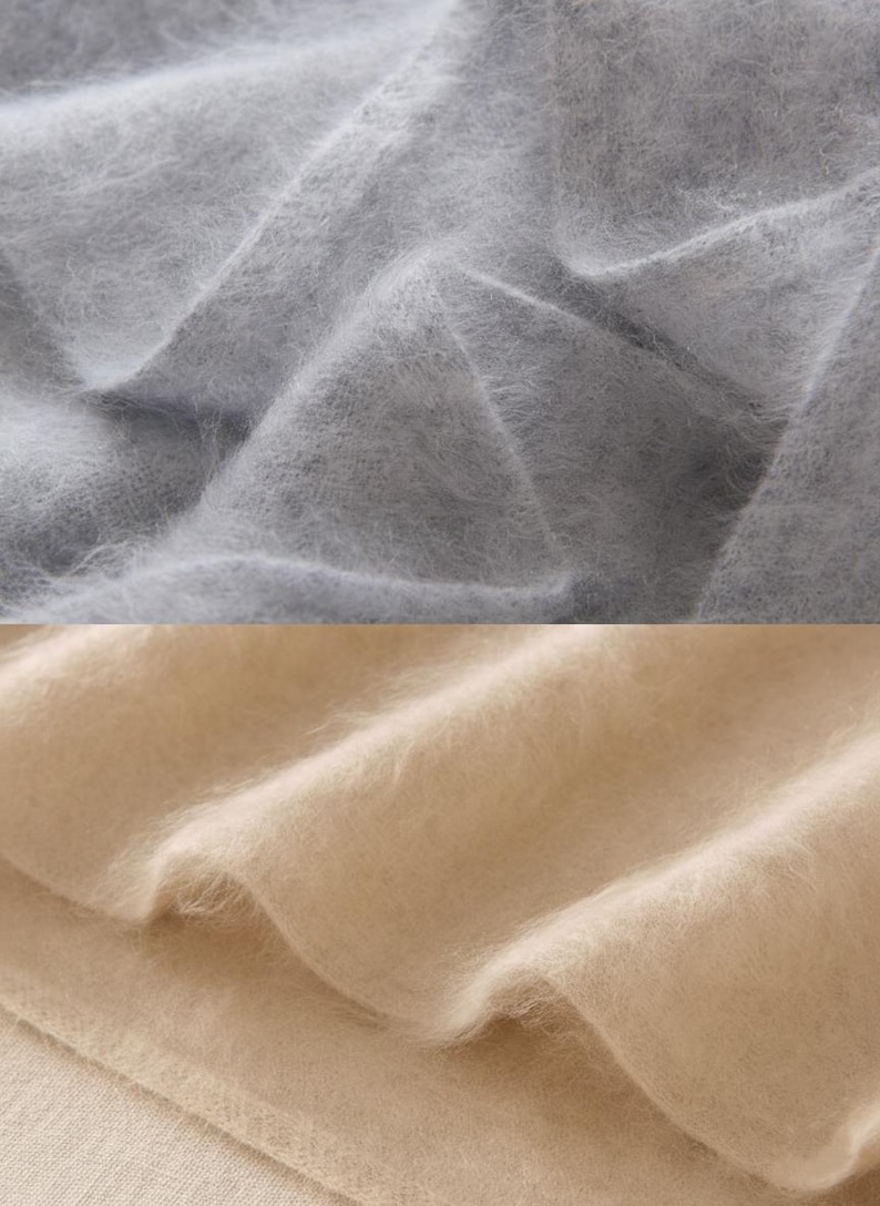 Peut inclure: Gros plan sur deux sections de tissu doux et duveteux. La section sup&eacute;rieure est gris clair et la section inf&eacute;rieure est beige chaud. Le tissu semble &ecirc;tre drap&eacute;, avec des plis et des textures visibles.