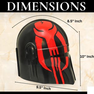 May include: A black helmet featuring a red graphic design on the side. The helmet has a visor opening and measures 8.5 inches in width, 10 inches in height, and 9.5 inches in depth. The text DIMENSIONS is displayed at the top of the image.