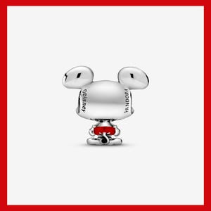 May include: A silver-colored charm in the shape of Mickey Mouse with the Disney and Pandora logos. The charm has a red accent and is set against a white background with a red border.