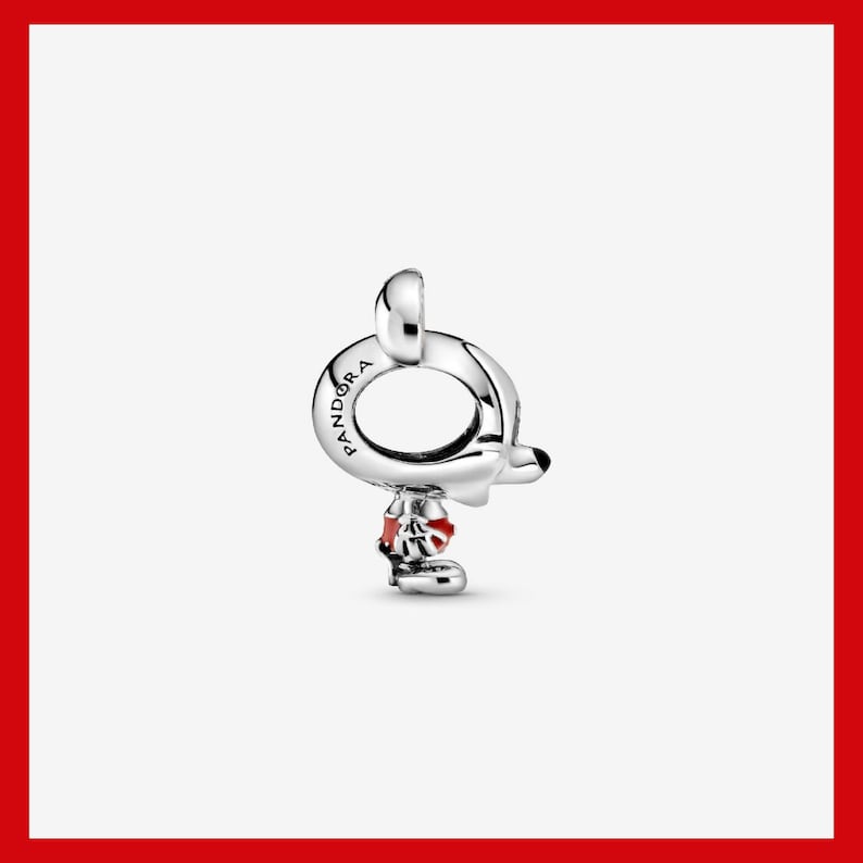 May include: A silver charm with a Mickey Mouse design. The charm features a round loop with the word "Pandora" engraved on it. Mickey's head and body are visible, with red accents on his shorts and shoes.