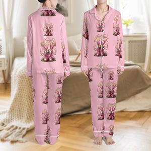 May include: A set of three ceramic mugs with a speckled, matte finish. The mugs are in shades of cream, light gray, and dark gray. Each mug has a simple, minimalist design and a rounded handle.