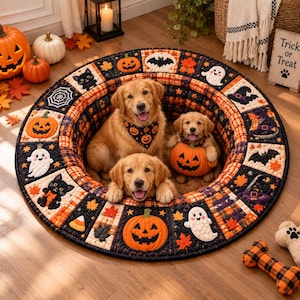 May include: A round, quilted pet bed featuring a Halloween-themed pattern with pumpkins, ghosts, black cats, bats, and autumn leaves in orange, black, and white. The bed has a raised, padded border and a soft, circular interior base for pets.