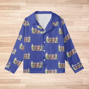 May include: A set of three ceramic vases in varying heights and shapes. The vases are glazed in a matte white finish, with a slightly textured surface. The tallest vase is approximately 10 inches high.