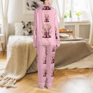 May include: A white ceramic mug with a black handle and the text "But First, Coffee" in a black, bold font. The mug is on a white surface. The mug is approximately 4 inches tall.