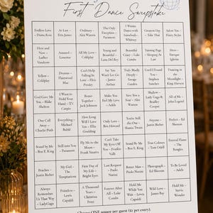 May include: A white rectangular sign titled Talia and Joe's First Dance Sweepstake with a disco ball icon. It features a grid of song titles and artists, with instructions at the bottom to choose one square per guest for one dollar each.
