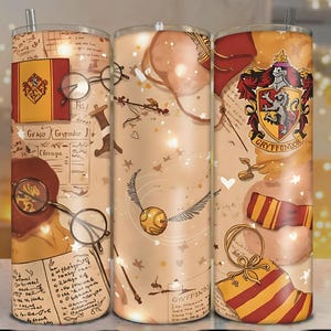 May include: Three stainless steel tumblers with a Harry Potter theme. Each tumbler features a different design, including the Gryffindor crest, a golden snitch, and parchment-style backgrounds with illustrations and text. The tumblers have a straw.