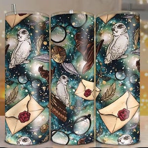 May include: A tumbler with a whimsical design featuring owls, envelopes with red wax seals, eyeglasses, feathers, and celestial elements. The background is a blend of teal, blue, and white, creating a starry effect. A silver straw is included.