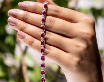 Lab Grown Ruby Tennis Bracelet — Oval Cut Ruby Halo Bracelet with Diamond Accent in Sterling Silver