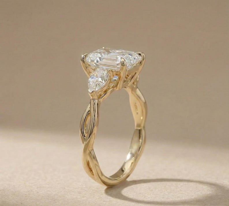 Pear diamond three-stone ring by ExcellentJewels, radiant cut, elegant and modern design. Ideal for engagement, anniversary, or custom jewelry lovers. Handcrafted with high-quality diamonds and precious metal for durability. A sparkling, timeless piece that adds sophistication and personalized elegance to any jewelry collection.