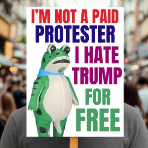 May include: A sign held by a person with the text "I'M NOT A PAID PROTESTER I HATE TRUMP FOR FREE" in red, blue, purple, and green. The sign features a green frog costume with black spots and a blue scarf.