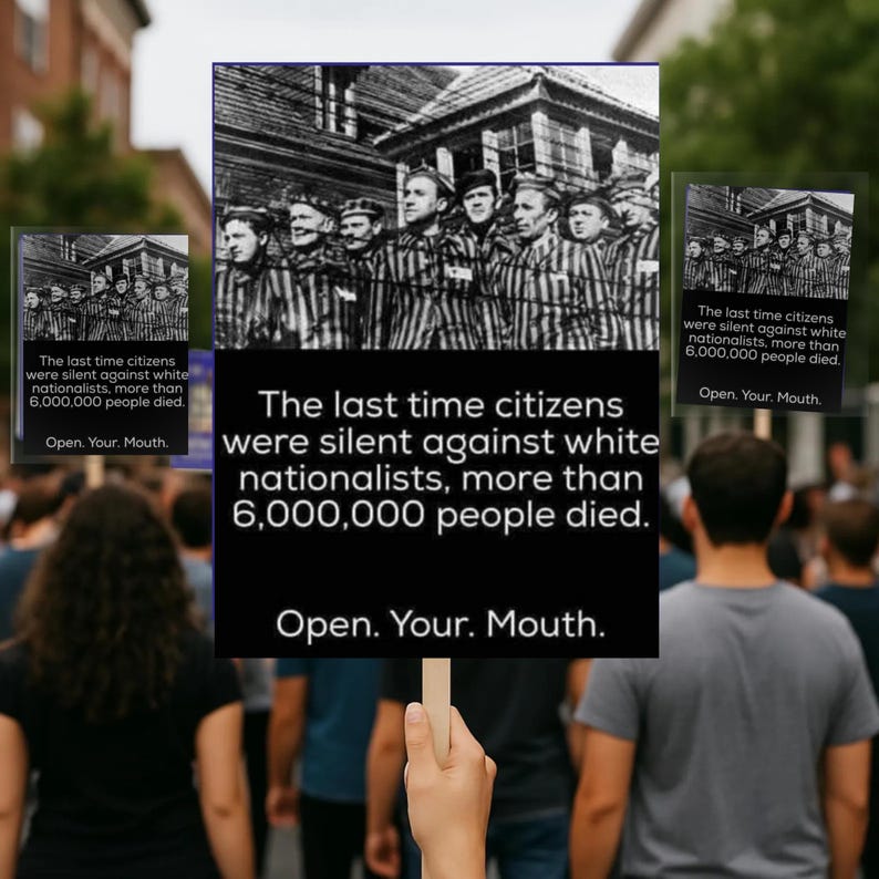 May include: A sign held up in a crowd with the text "The last time citizens were silent against white nationalists, more than 6,000,000 people died. Open. Your. Mouth." The sign has a black and white image of people in striped uniforms.