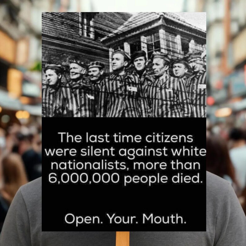 May include: A black and white image of a group of men in striped uniforms behind barbed wire. The image includes text that reads: "The last time citizens were silent against white nationalists, more than 6,000,000 people died. Open. Your. Mouth."