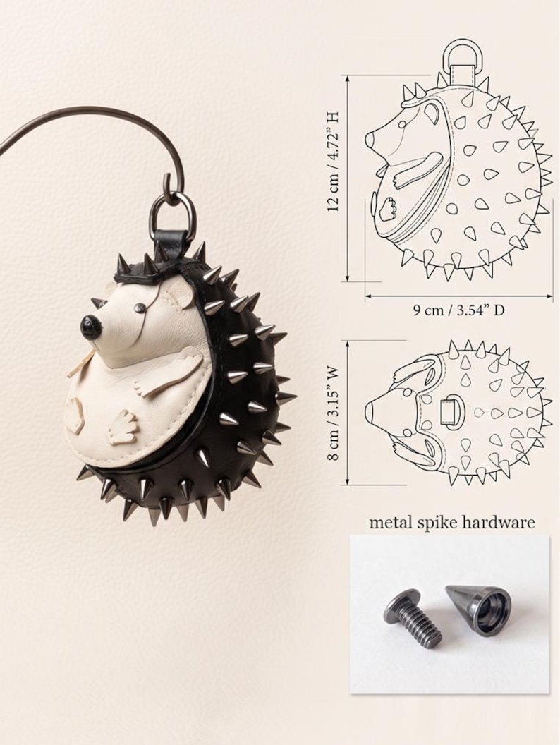 May include: A black and white hedgehog-shaped accessory with metal spike hardware. The accessory is 4.72 inches high, 3.54 inches in diameter, and 3.15 inches wide. The design includes a top loop for hanging.