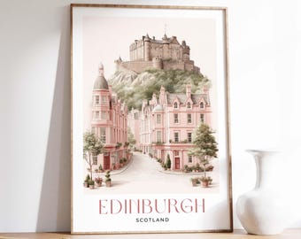 May include: A framed watercolor print of Edinburgh, Scotland. The artwork depicts a street scene with pink buildings and a castle on a hill. The text "EDINBURGH SCOTLAND" is at the bottom of the print.