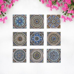 May include: Nine square ceramic tiles featuring intricate blue, green and gold mandala designs. The tiles are arranged in a 3x3 grid.