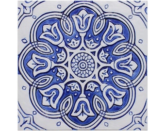 May include: A blue and white ceramic tile with a floral pattern. The tile has a raised design and a glossy finish.