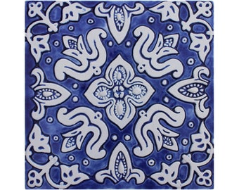 May include: Blue and white ceramic tile with a repeating floral pattern. The tile has a raised design and a glossy finish.