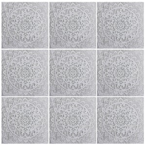 May include: Nine white square tiles with intricate, symmetrical, mandala-like designs. Each tile features a circular pattern with a central motif and radiating lines.