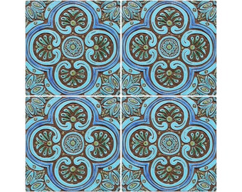 May include: Four square ceramic tiles with a blue and brown geometric pattern. The tiles have a raised design and a glossy finish.