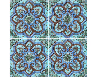 May include: Four square ceramic tiles with a blue, green, and brown floral pattern. The tiles have a raised design and a glossy finish.