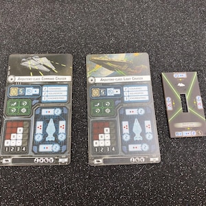 May include: Three Star Wars Armada game cards. Two cards are labeled "Arquitens-Class Command Cruiser" and "Arquitens-Class Light Cruiser". The third card is a maneuver card. The cards have various symbols and numbers.