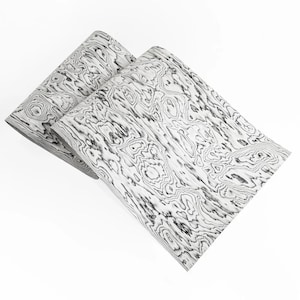 May include: Two rectangular pieces of material with a wood grain pattern in shades of gray and white. The pattern has a swirling, organic design. The pieces are angled towards each other, creating a layered effect. The background is plain white.