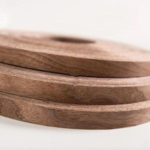 May include: A set of three ceramic mugs with a speckled, matte finish. The mugs are in shades of cream, light gray, and dark gray. Each mug has a simple, minimalist design, perfect for coffee or tea.