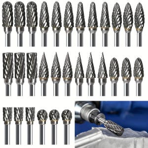 May include: A collection of silver rotary burr bits with various head shapes, including cylindrical, conical, and ball-shaped designs. The bits are designed for use with a rotary tool and are arranged in neat rows, showcasing their different cutting profiles.