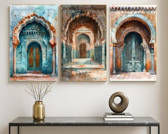 May include: Set of three watercolor prints featuring architectural scenes with arched doorways and intricate details. The artwork showcases a palette of teal, orange, and brown hues, creating a warm and inviting atmosphere. The prints are framed and ready to hang.