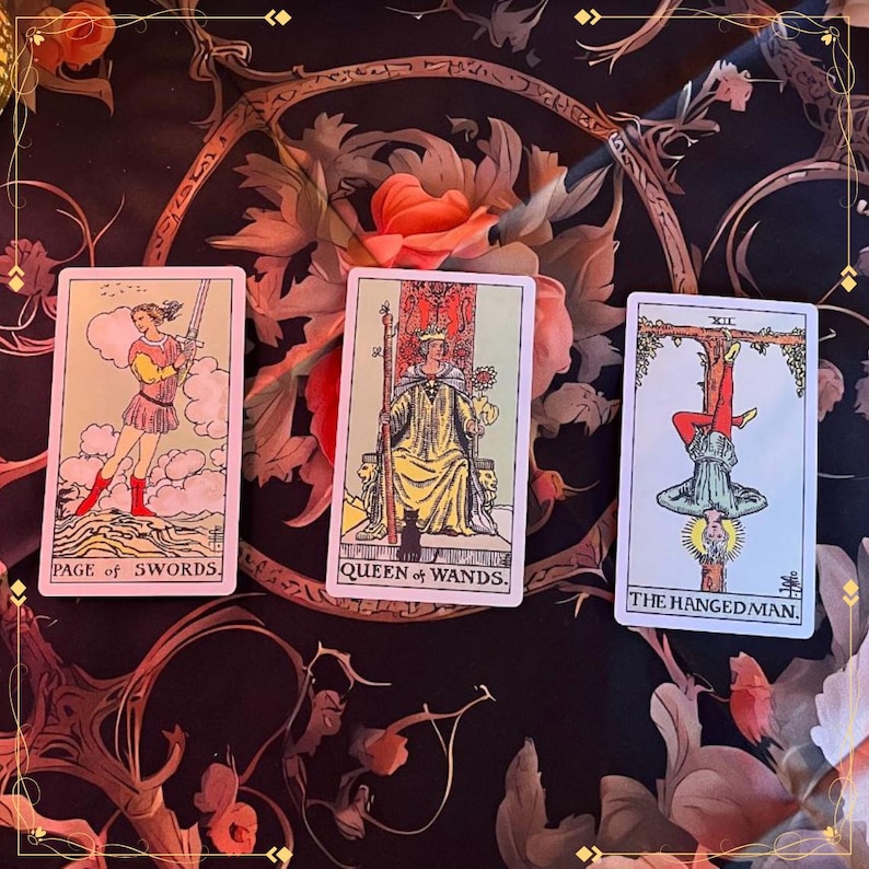 May include: Three tarot cards arranged horizontally. The left card is labeled Page of Swords, the center card is labeled Queen of Wands, and the right card is labeled The Hanged Man. Each card features a distinct illustration with colorful figures.