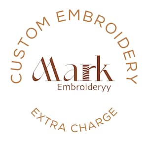 May include: A white background with a brown logo that says "CUSTOM EMBROIDERY" in a semi-circle. The logo says "Mark Embroideryy" in brown text. Below the logo is the text "EXTRA CHARGE" in a semi-circle.