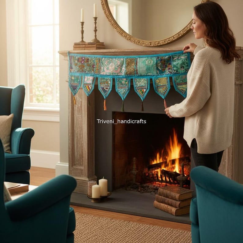 May include: A decorative fireplace mantel scarf with a patchwork design in shades of teal, green, and gold. The scarf has a teal border and decorative tassels. The text "Triveni_handicrafts" is visible on the mantel.