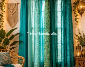 May include: A set of teal curtains with tab tops, featuring a mix of solid panels and panels with intricate floral patterns. The text Triveni-handicrafts is visible in the center. The curtains are hung on a black rod with a decorative garland.