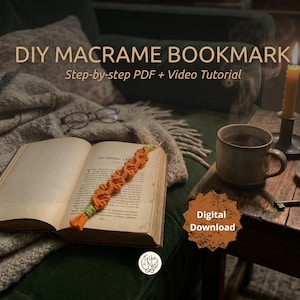 May include: An open book with a handmade orange macrame bookmark. The text "DIY MACRAME BOOKMARK" and "Step-by-step PDF + Video Tutorial" are visible. A mug, candle, and the words "Digital Download" are also in the image.