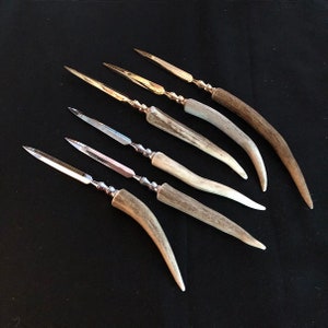 Antler manejó el abridor de cartas