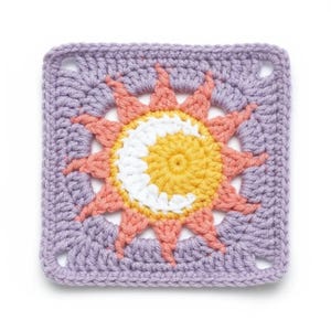 May include: A square, crocheted sun design in shades of yellow, white, and peach, surrounded by a lavender border. The sun's rays are peach, and the center is yellow with a white crescent. The corners have small square openings.