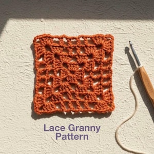 May include: A square of orange crochet fabric with a lace granny pattern. The text "Lace Granny Pattern" is visible. A crochet hook and yarn are in the image.